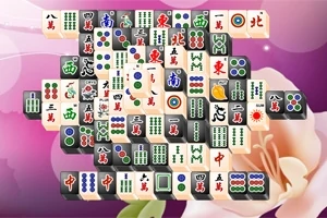 Piese de Mahjong aranjate pe un fundal roz cu motive florale delicate