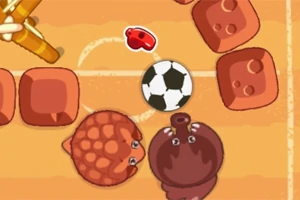 Două creaturi rotunde și o minge de fotbal pe un teren cu blocuri rotunjite
