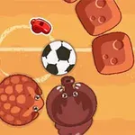 Două creaturi rotunde și o minge de fotbal pe un teren cu blocuri rotunjite