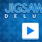 Text „Jigsaw Deluxe” pe un fundal albastru cu un model de piese de puzzle și un buton de redare în centru