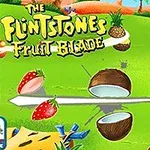 Imaginea prezintă fructe tăiate, inclusiv o nucă de cocos, o portocală și căpșuni, pe un fundal verde cu titlul The Flintstones Fruit Blade în colțul stânga sus