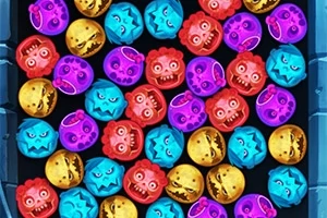 Bile colorate cu fețe monstruoase, grupate într-un spațiu dreptunghiular