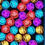 Bile colorate cu fețe monstruoase, grupate într-un spațiu dreptunghiular